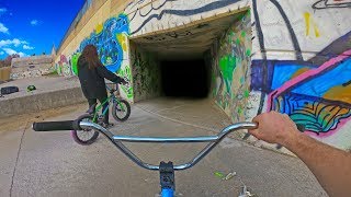 BMX RIDING INTO DARK SEWAGE PIPE