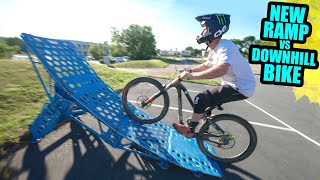 RIDING MY NEW BIG KICKER RAMP ON THE DOWNHILL...