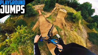 THE BOYS RIDING THE PLAYGROUND DIRT JUMPS...
