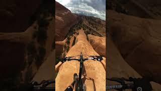 MTBer rides down a cliff with no climbing gear