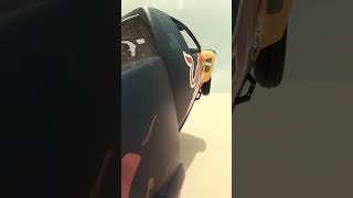 V8 truck power wheelies in the dunes
