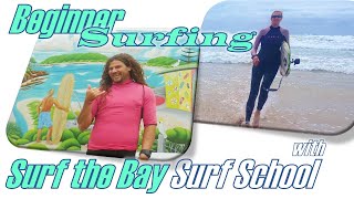 Learning with Surf the Bay Surf School on...