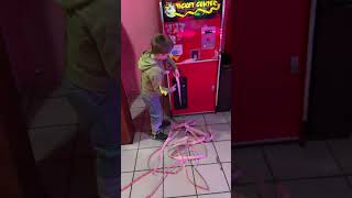 My little dude feeding his tickets into the...