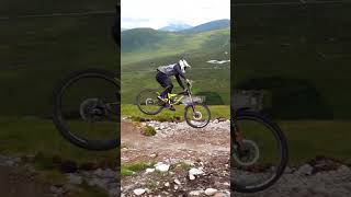 Downhill MTB racer sends a solid gap jump!...