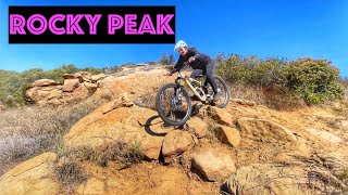 Mountain biking steep trails on the windiest...