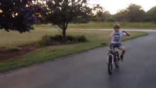 Kid Eating Spree Candies While Riding Bike...