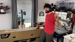 Guy building a bike in his living room