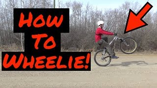 How To Wheelie A Mountain Bike / BMX!