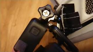 Inserting GoPro Hero 7 into the cage, with it...