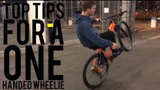 HOW TO WHEELIE WITH ONE HAND // NO FRONT WHEEL...